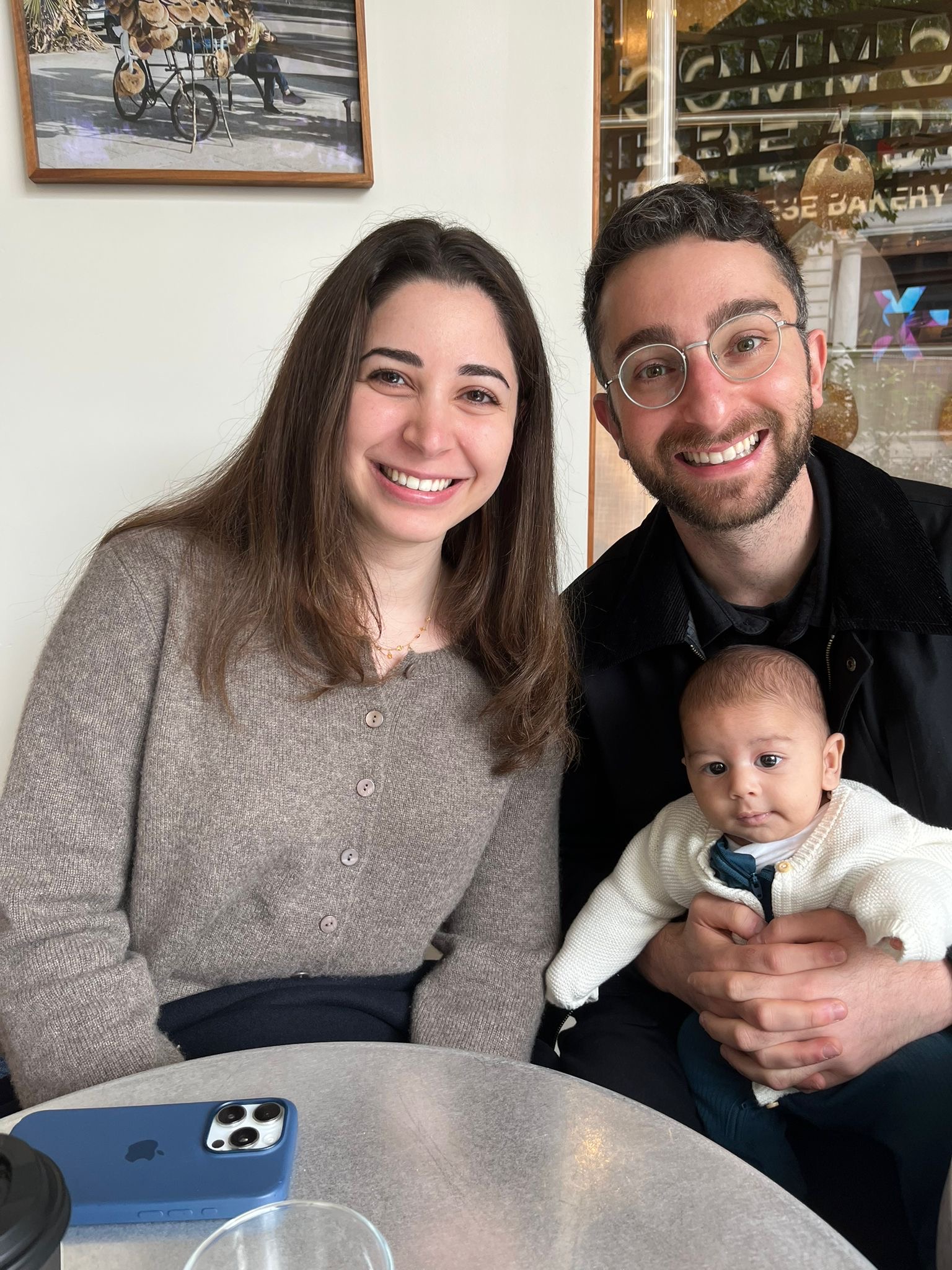 Jad and Reem with a baby at a bakery
